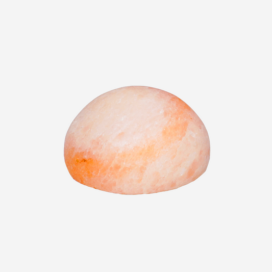 Himalayan rock salt Massage stone on a white background